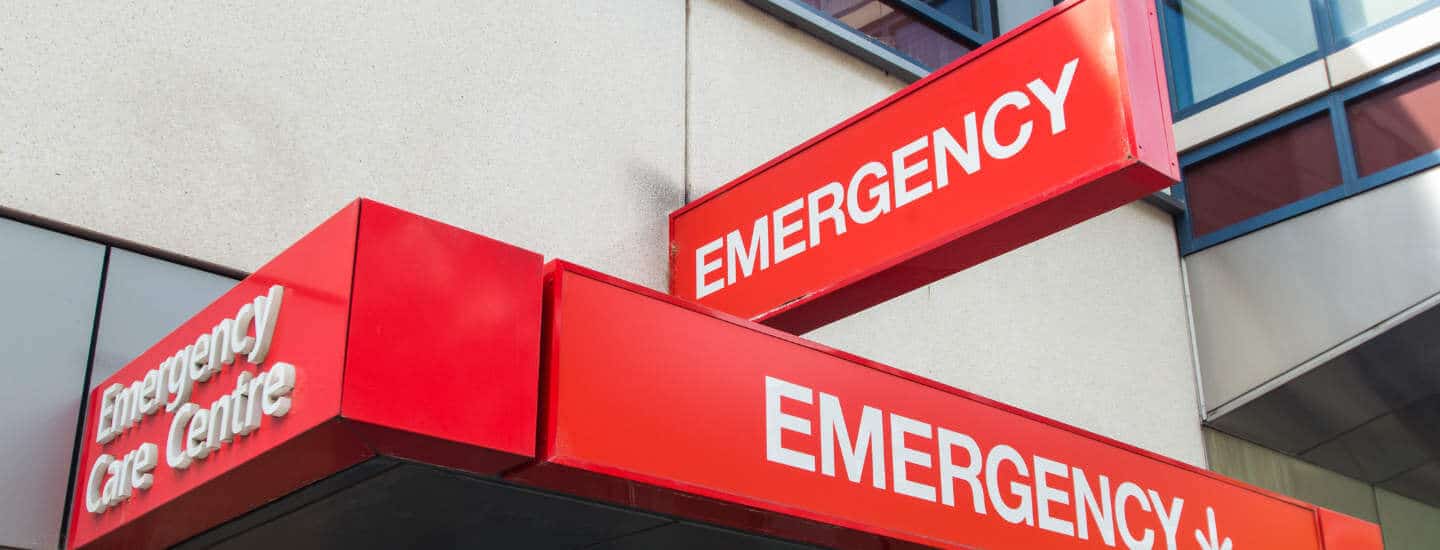 An image of a Emergency Department sign outside of a hospital building.