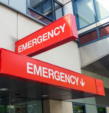 An image of a Emergency Department sign outside of a hospital building.